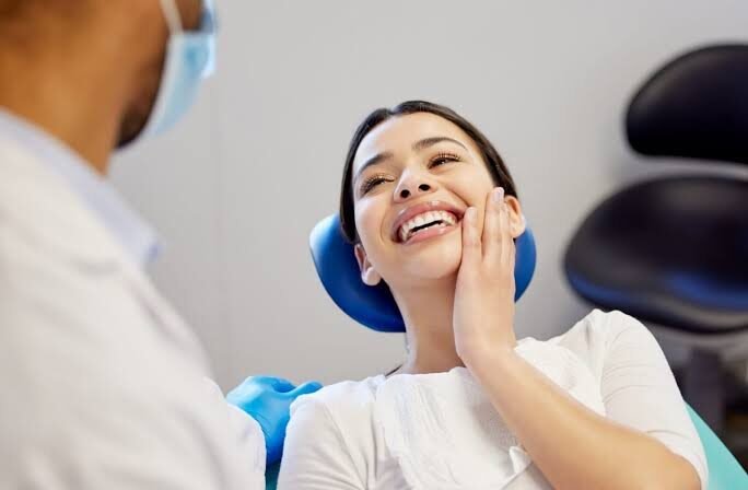 Patient smiling after a visit to Real Dent Dental Clinic
